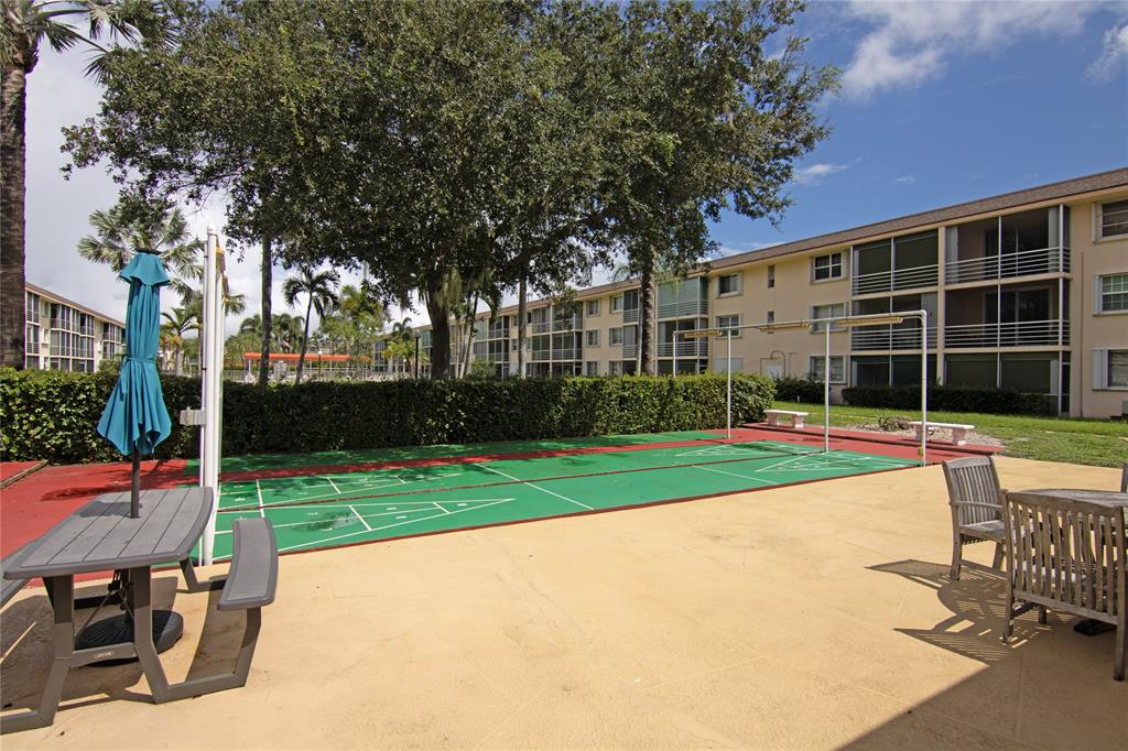 4500 North Federal Highway, Unit 158G Lighthouse Point, FL 33064 - Photo 34 of 36 a view of a house with backyard and sitting area