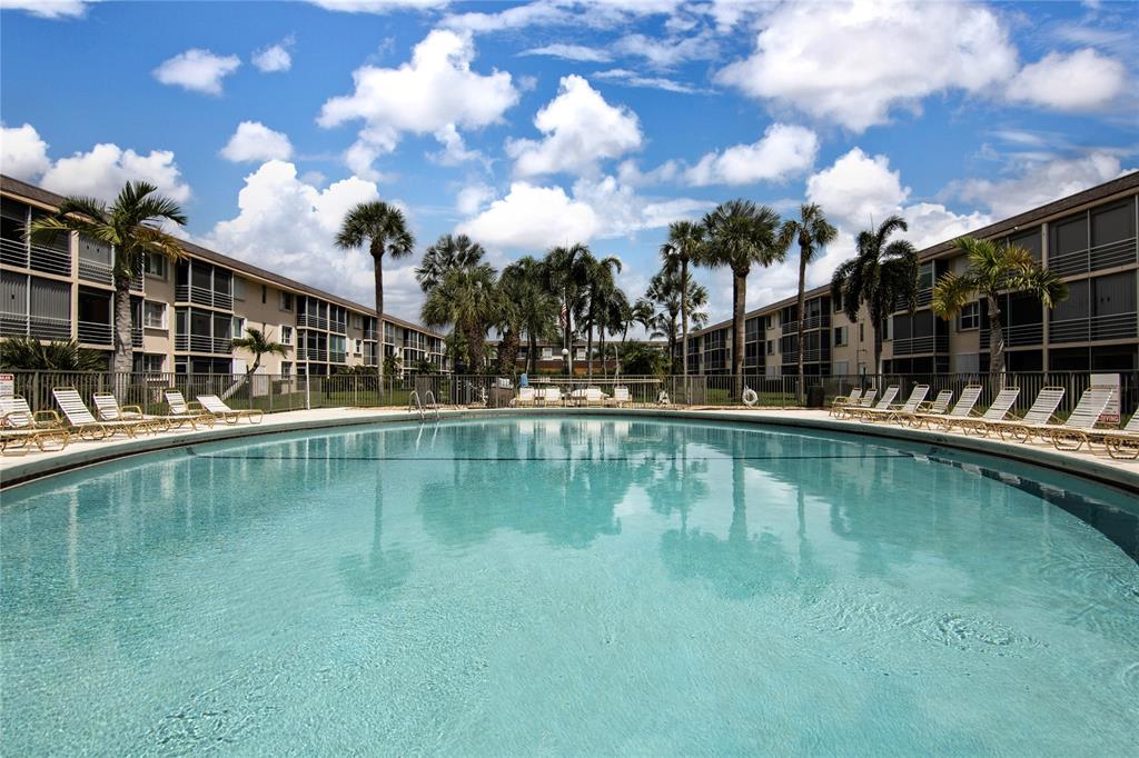 4500 North Federal Highway, Unit 158G Lighthouse Point, FL 33064 - Photo 36 of 36 a view of swimming pool with outdoor seating and deck in the back
