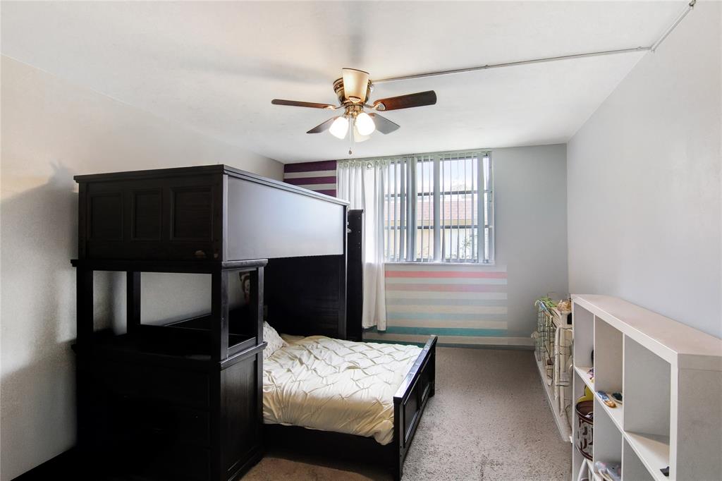 4500 North Federal Highway, Unit 158G Lighthouse Point, FL 33064 - Photo 9 of 36 a bedroom with furniture and a window