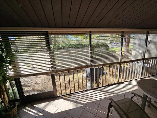 a view of a balcony with wooden floor