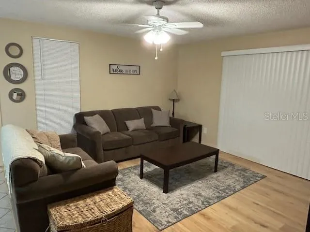 a living room with furniture and a rug