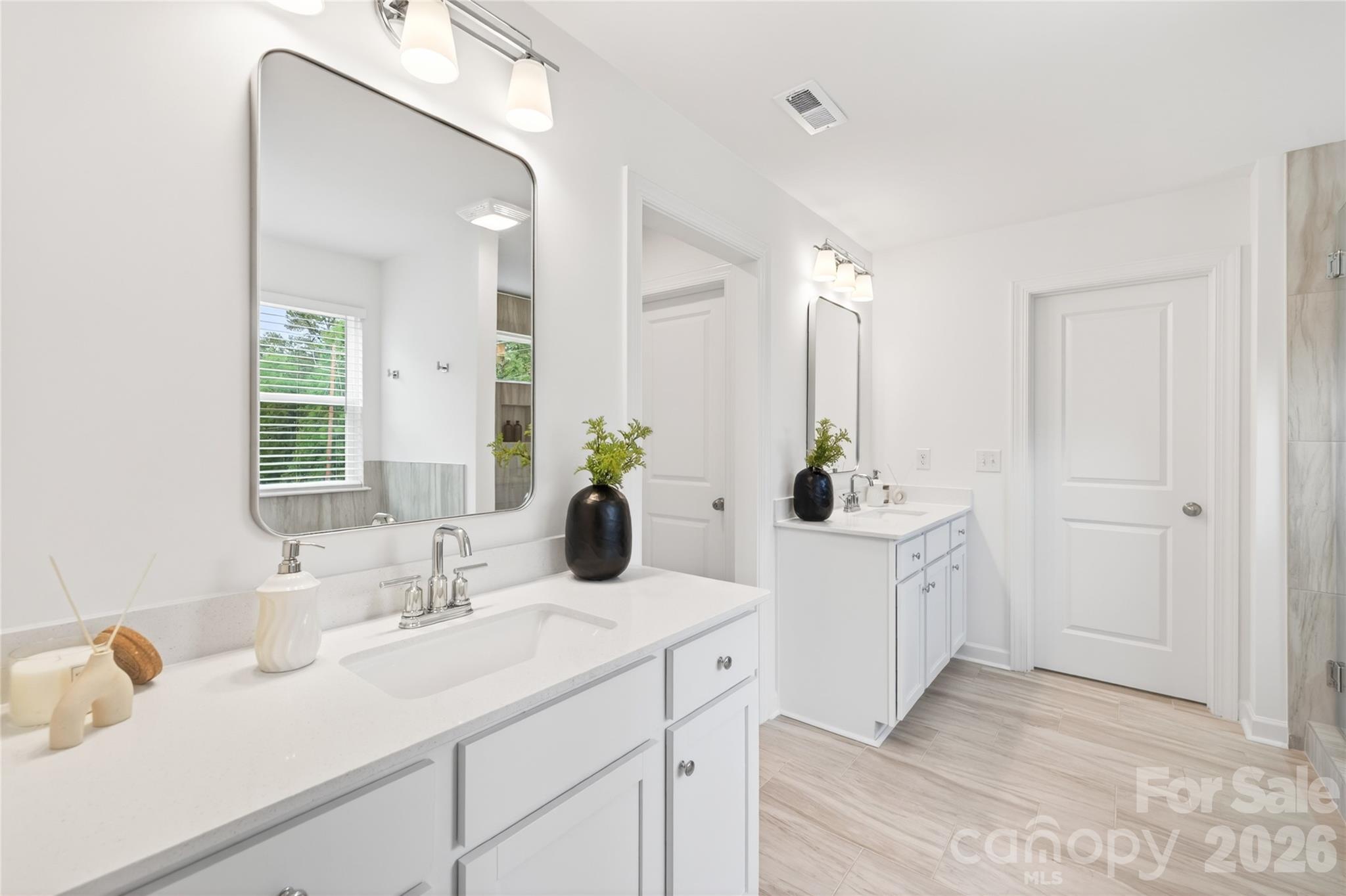128 Overcash Road, Unit 7171 Troutman, NC 28166 - Photo 22 of 41 a bathroom with a sink and a mirror