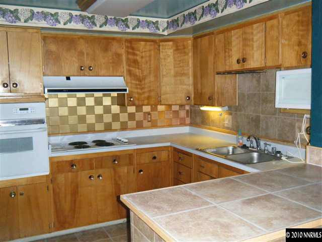 1955 West 6th Street Reno, NV 89503 - Photo 3 of 9 a bathroom with a sink and a mirror