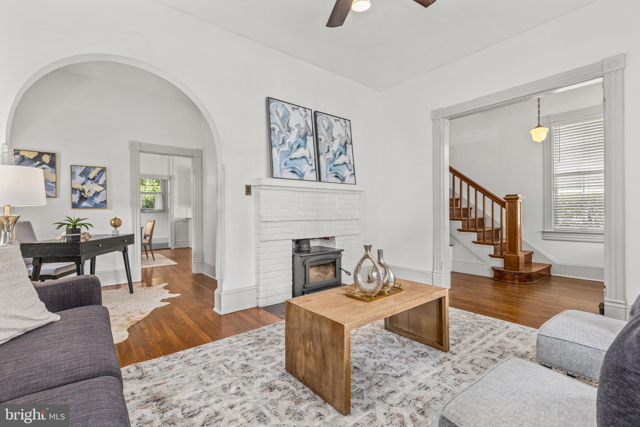 4916 40th Place Hyattsville, MD 20781 - Photo 11 of 48 a living room with furniture and a fireplace