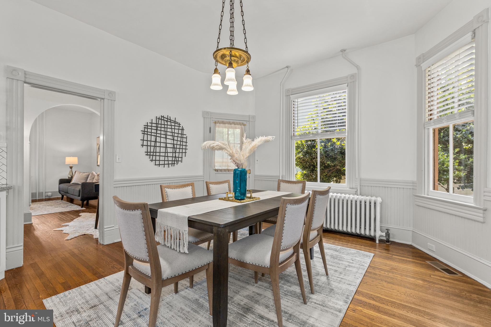 4916 40th Place Hyattsville, MD 20781 - Photo 15 of 48 a view of a dining room with furniture wooden floor and a chandelier