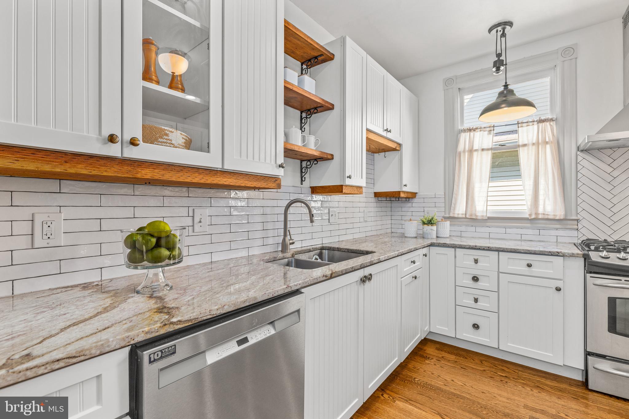 4916 40th Place Hyattsville, MD 20781 - Photo 16 of 48 a kitchen with sink and window
