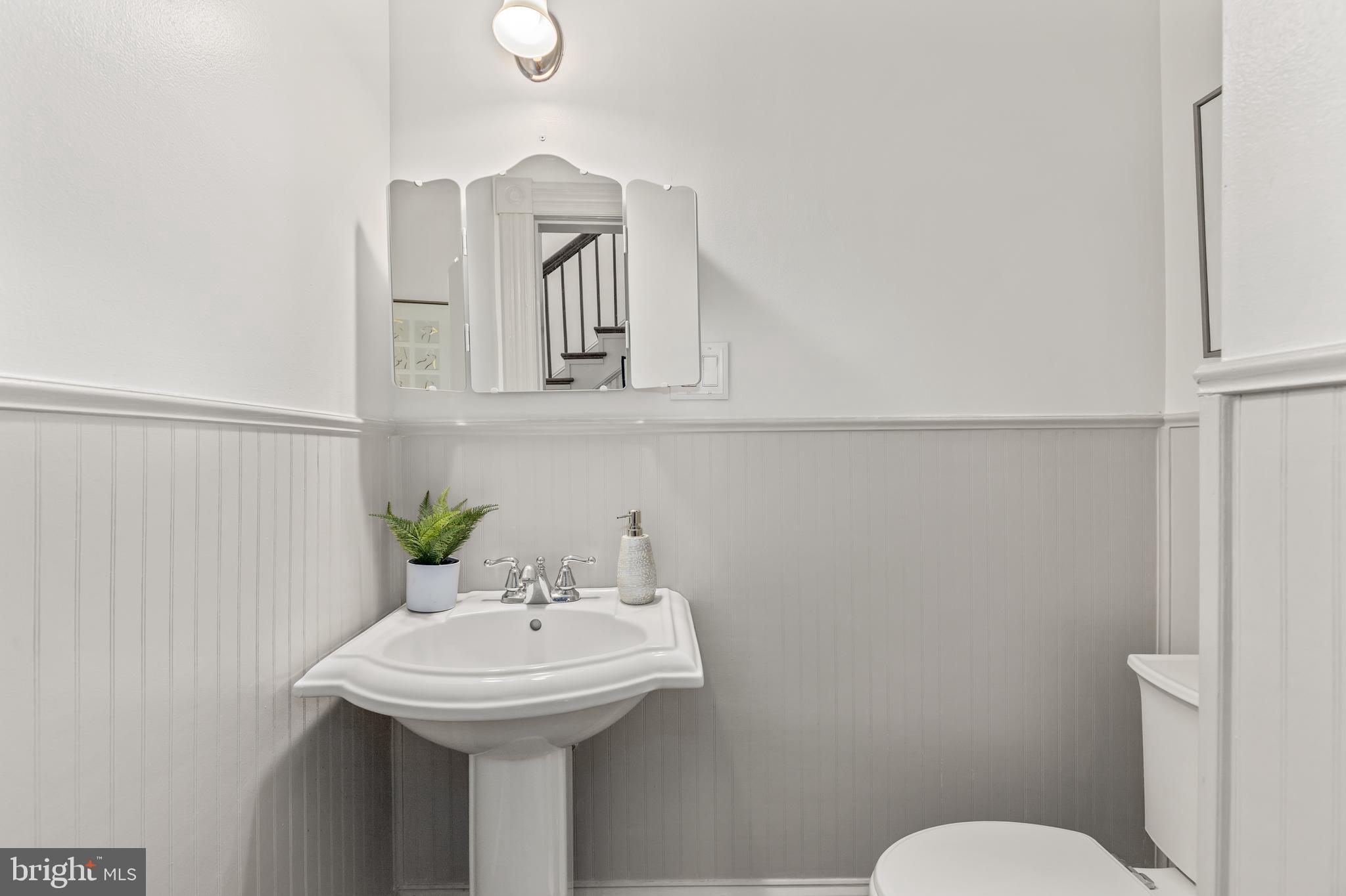 4916 40th Place Hyattsville, MD 20781 - Photo 19 of 48 a bathroom with a sink a toilet and mirror