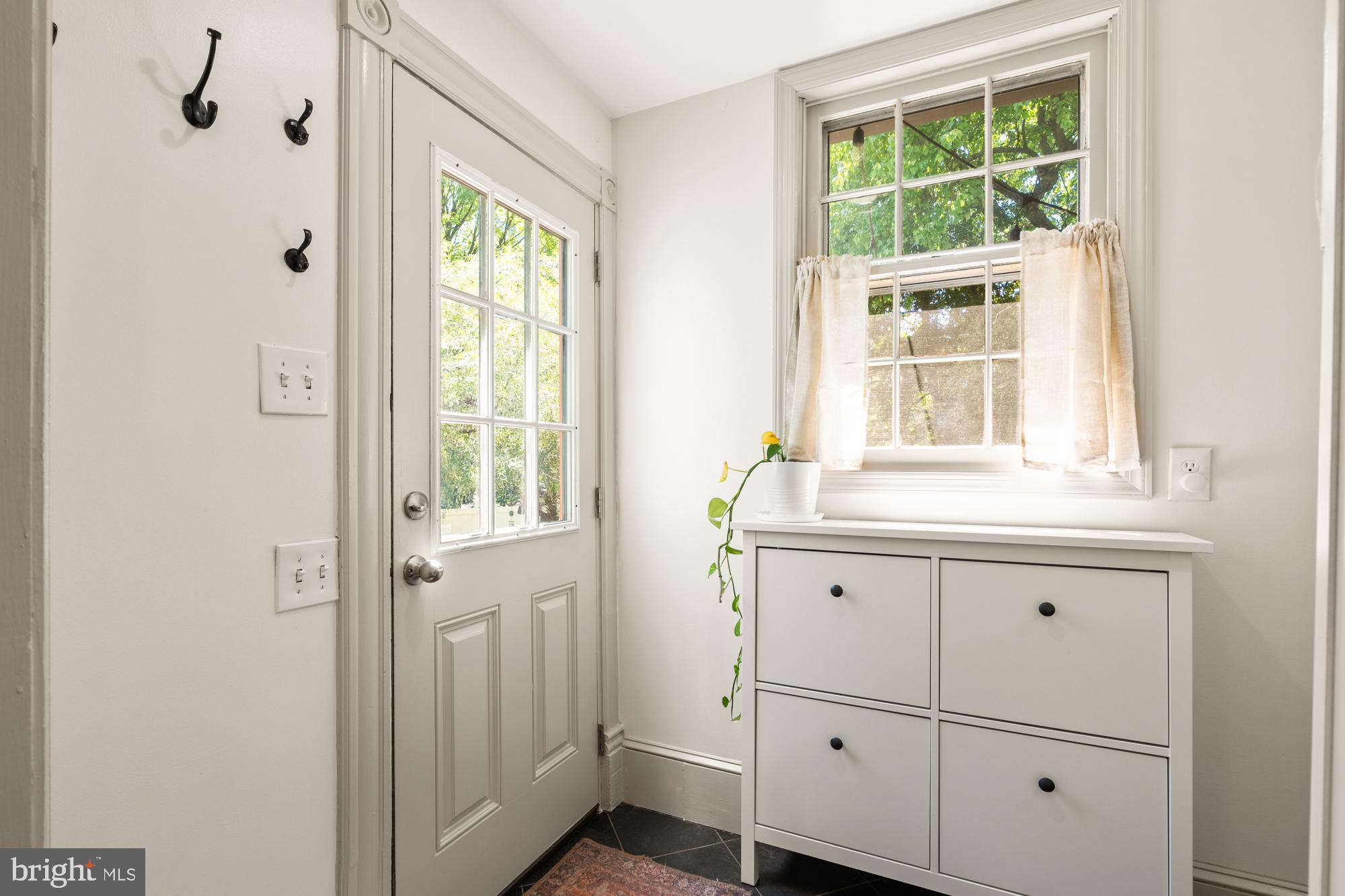 4916 40th Place Hyattsville, MD 20781 - Photo 20 of 48 a bathroom with a window sink and mirror