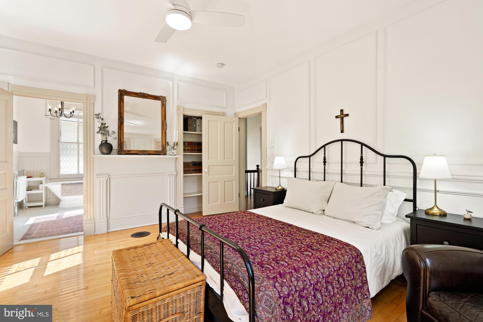 4916 40th Place Hyattsville, MD 20781 - Photo 24 of 48 a bedroom with a large bed and a chandelier