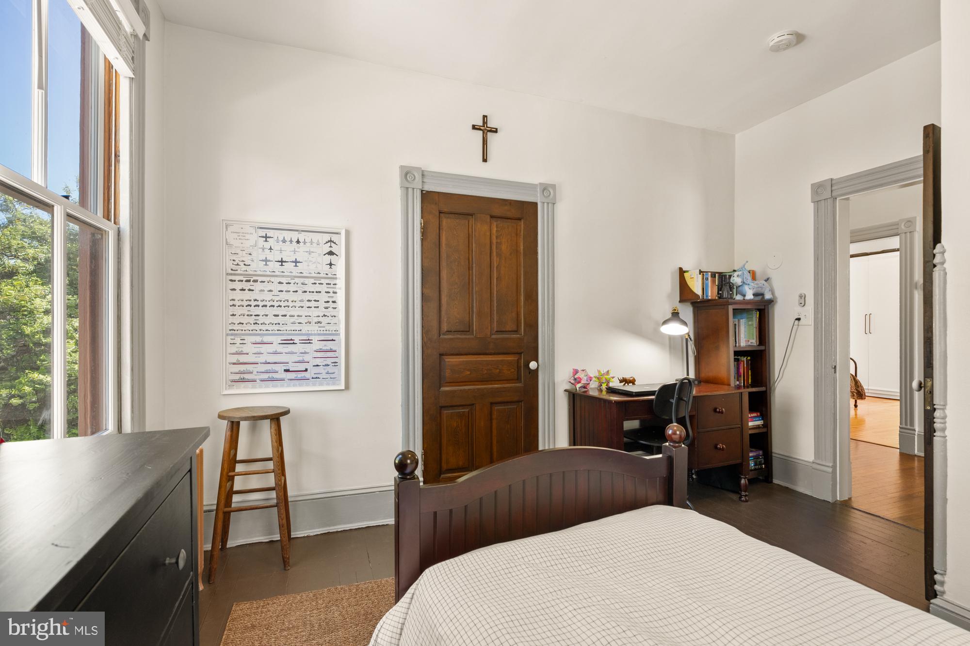 4916 40th Place Hyattsville, MD 20781 - Photo 31 of 48 a bedroom with a bed and wooden floor