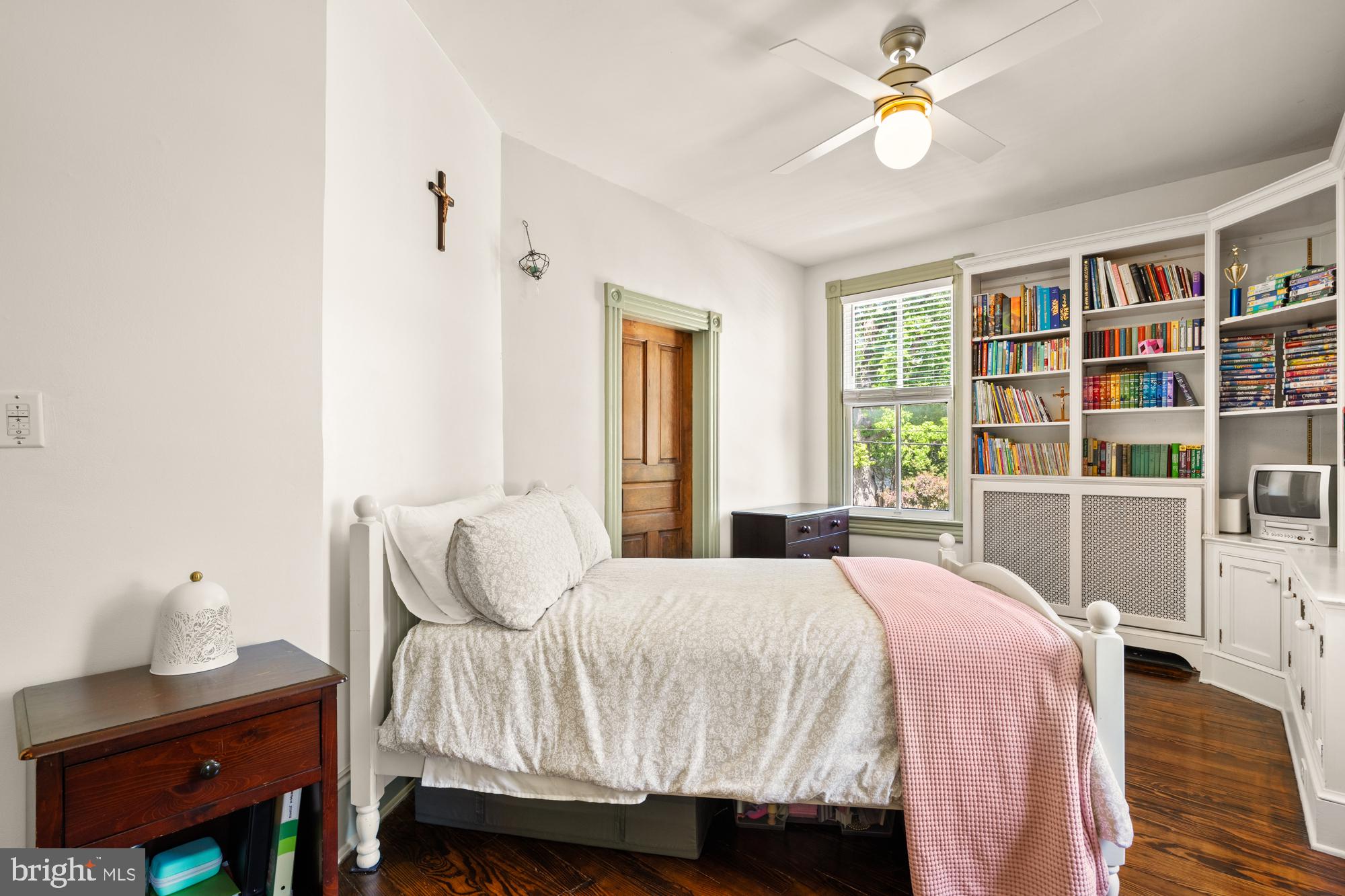 4916 40th Place Hyattsville, MD 20781 - Photo 33 of 48 a bedroom with a bed and a potted plant