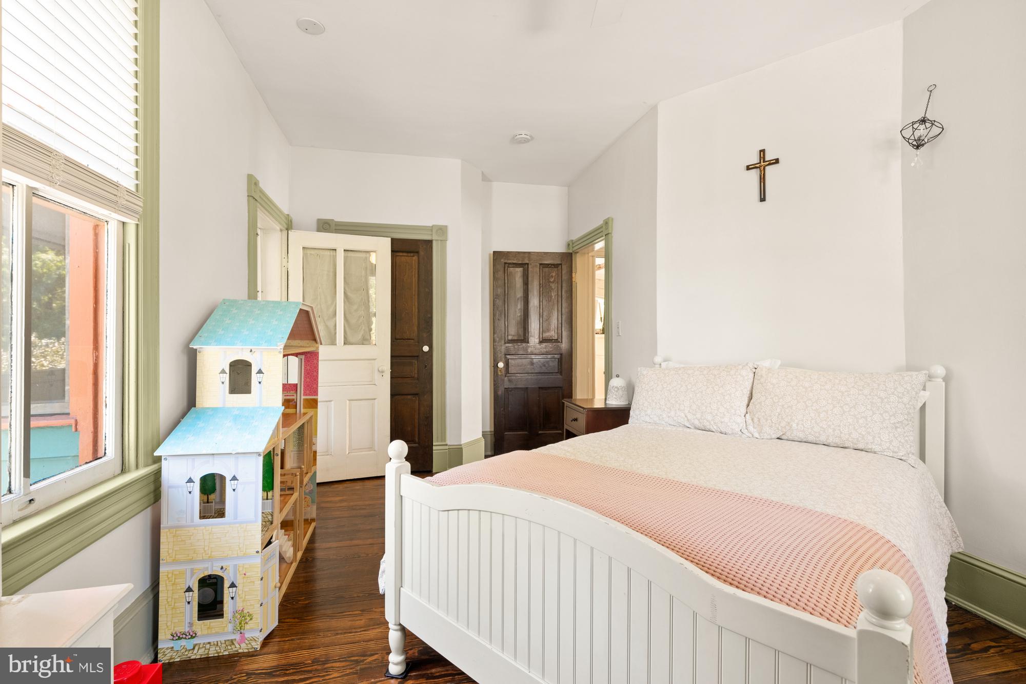 4916 40th Place Hyattsville, MD 20781 - Photo 35 of 48 a bedroom with a bed and wooden floor