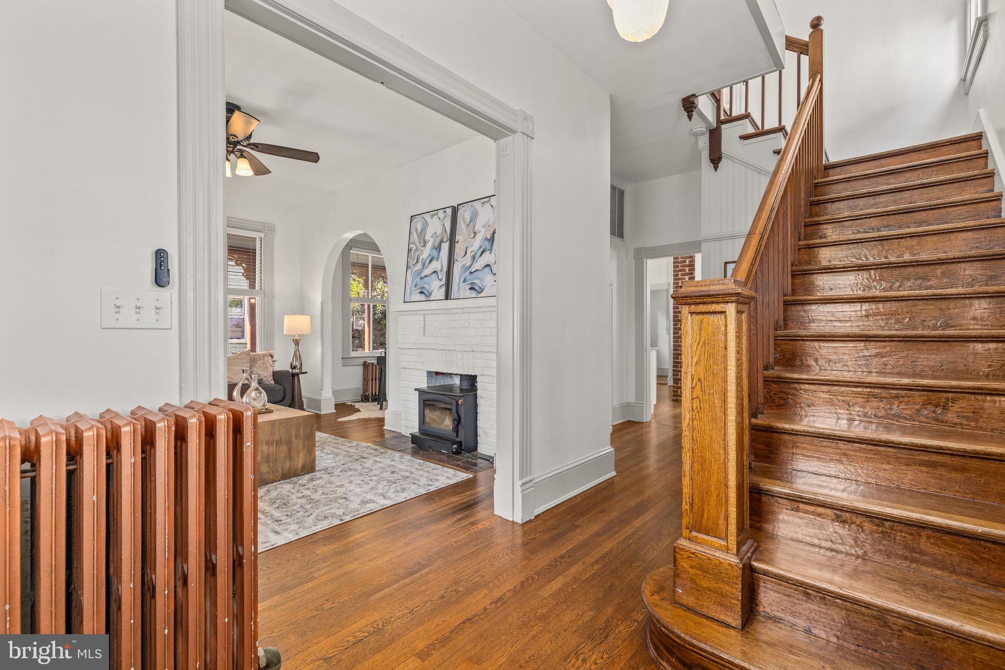 4916 40th Place Hyattsville, MD 20781 - Photo 8 of 48 a view of a livingroom with wooden floor and staircase