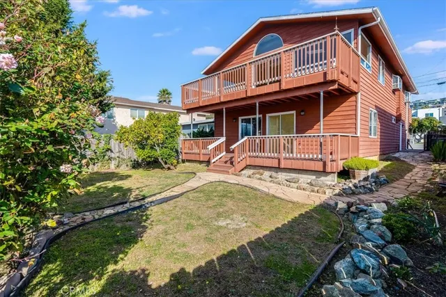 a view of a small yard and deck