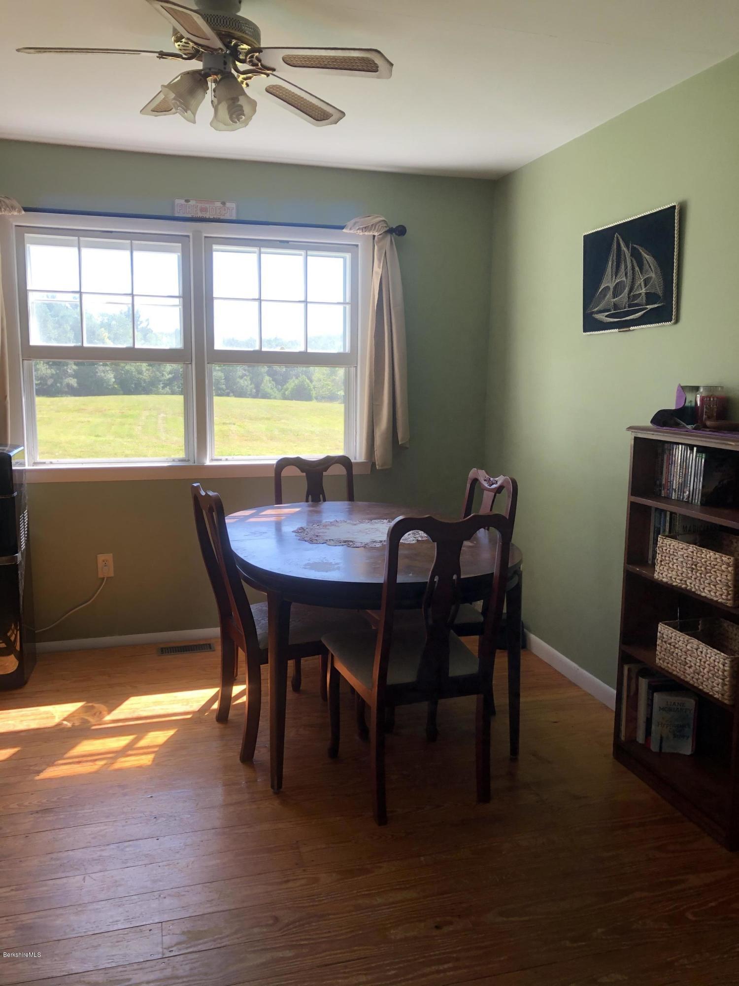 467 Old Post Road Worthington, MA 01098 - Photo 14 of 40 a view of a dining room with furniture window and wooden floor