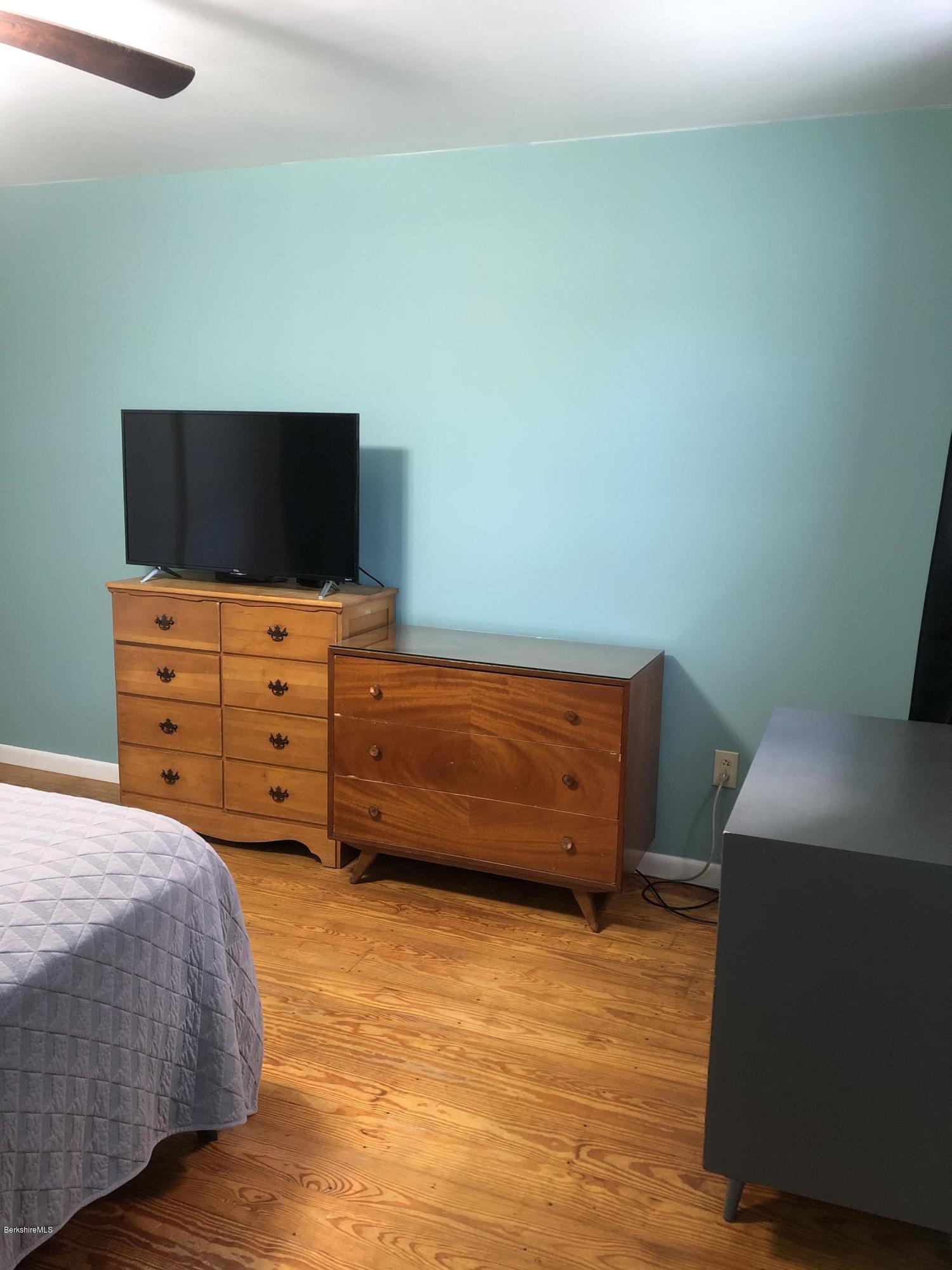 467 Old Post Road Worthington, MA 01098 - Photo 22 of 40 a bedroom with a bed and television