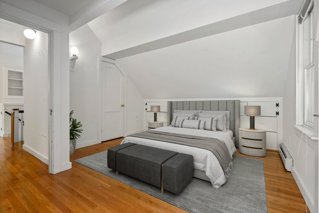 34 Westminster Road Newton, MA 02459 - Photo 21 of 40 a spacious bedroom with a bed and wooden floor