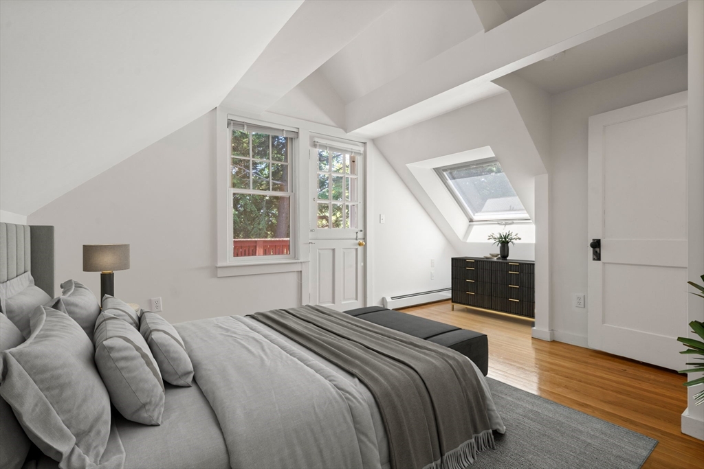 34 Westminster Road Newton, MA 02459 - Photo 22 of 40 a bedroom with a bed and wooden floor