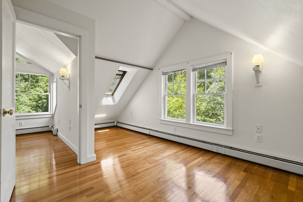34 Westminster Road Newton, MA 02459 - Photo 24 of 40 a view of an empty room with wooden floor and a window