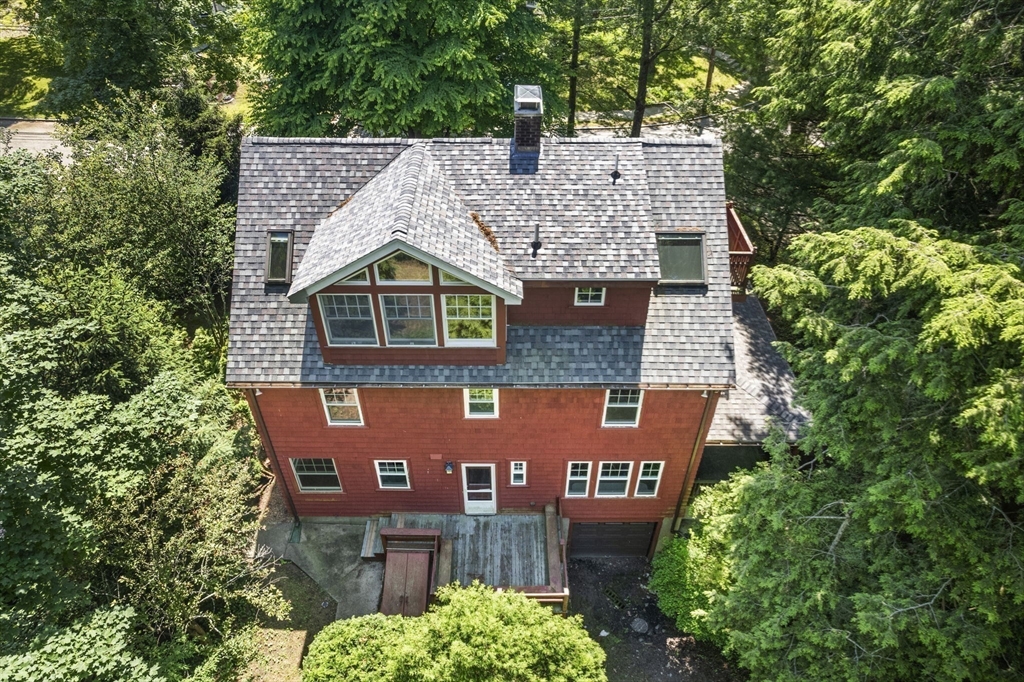34 Westminster Road Newton, MA 02459 - Photo 32 of 40 a view of a house with a yard and potted plants