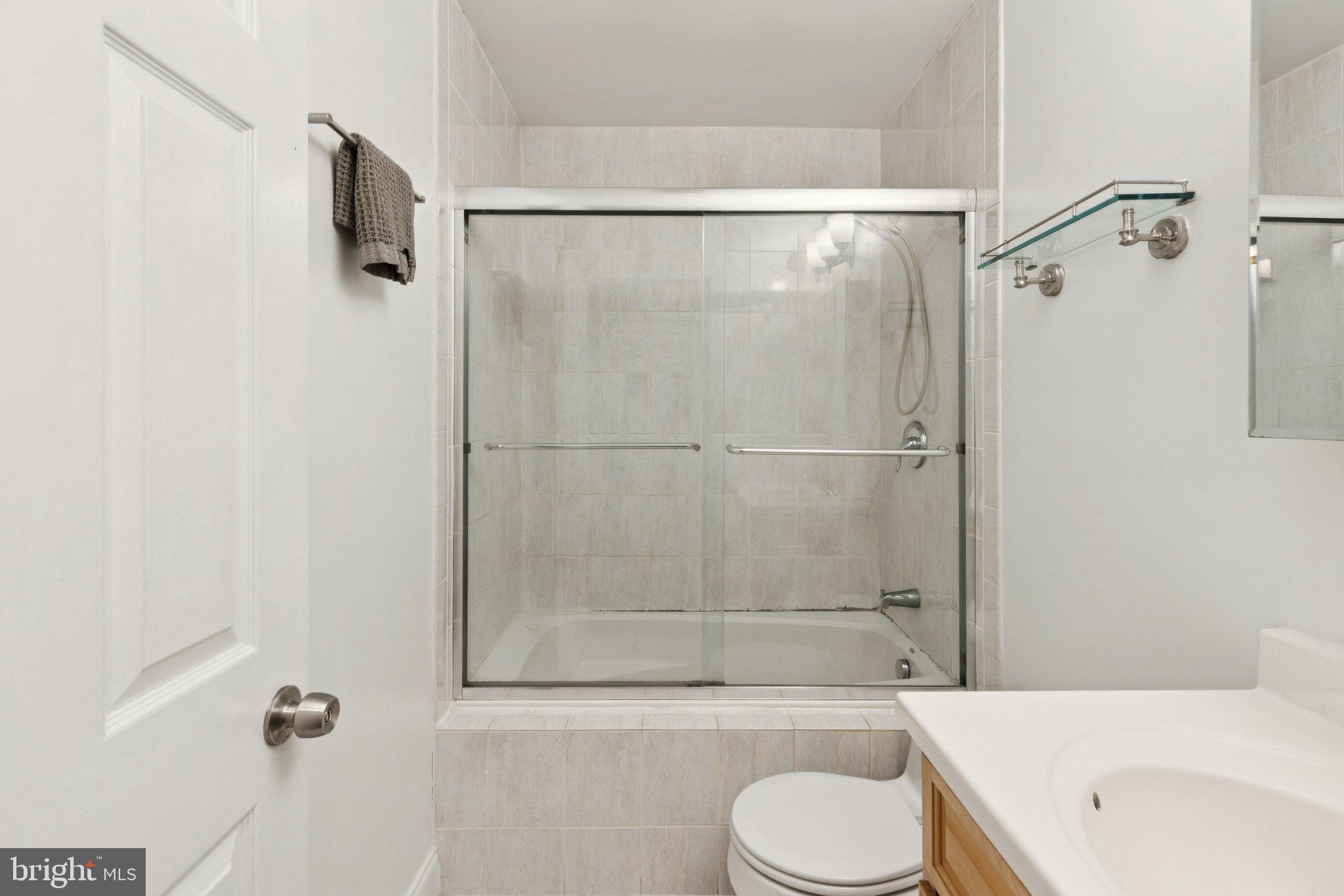1232 South Street, Unit A Philadelphia, PA 19147 - Photo 11 of 27 a bathroom with a shower toilet and a sink