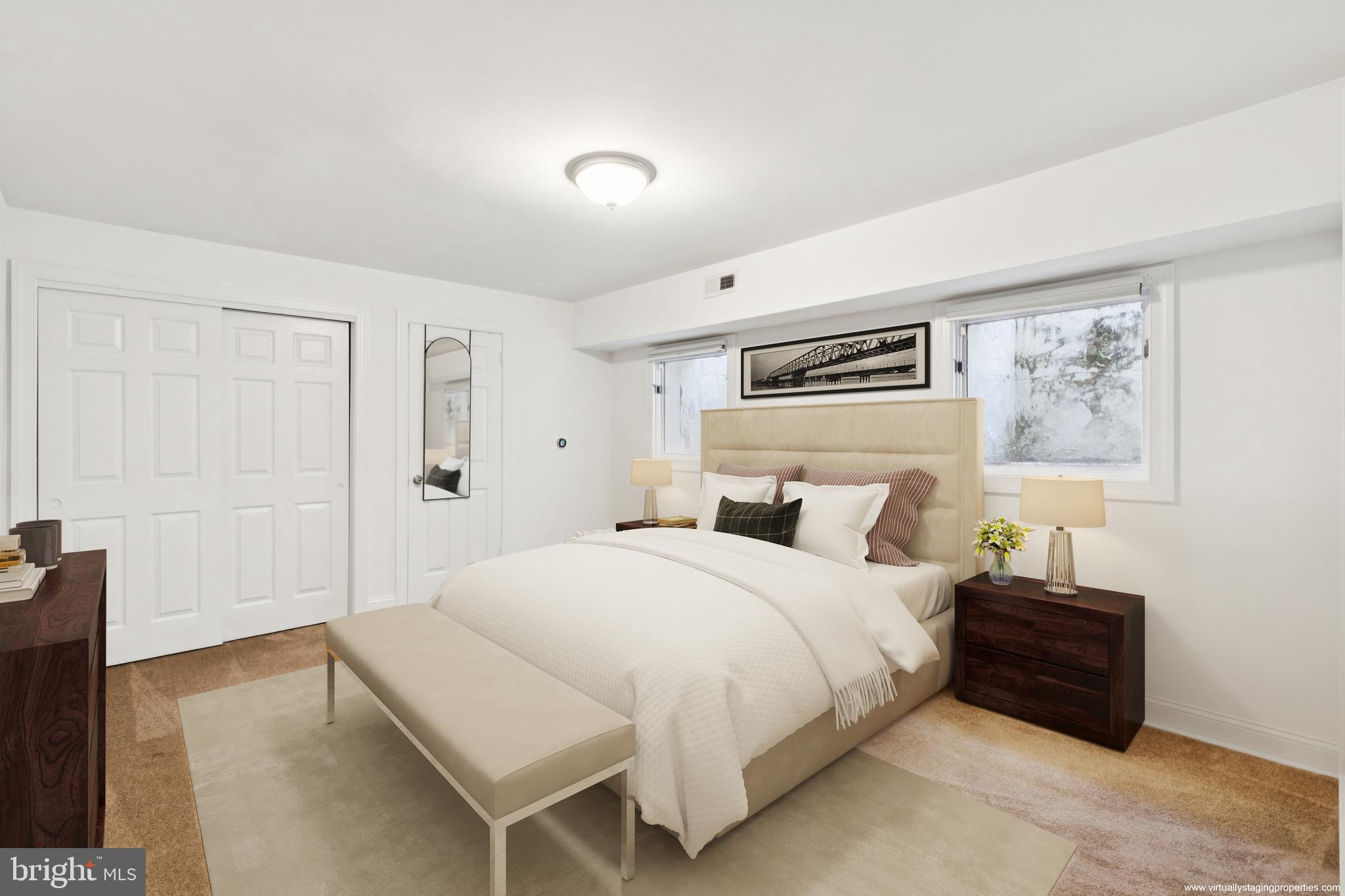 1232 South Street, Unit A Philadelphia, PA 19147 - Photo 18 of 27 a bedroom with a bed and a painting on the wall