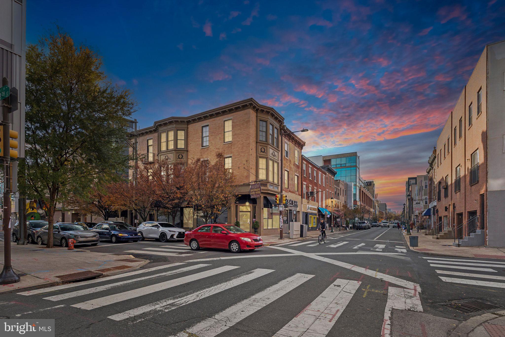 1232 South Street, Unit A Philadelphia, PA 19147 - Photo 27 of 27 a city street lined with buildings and cars