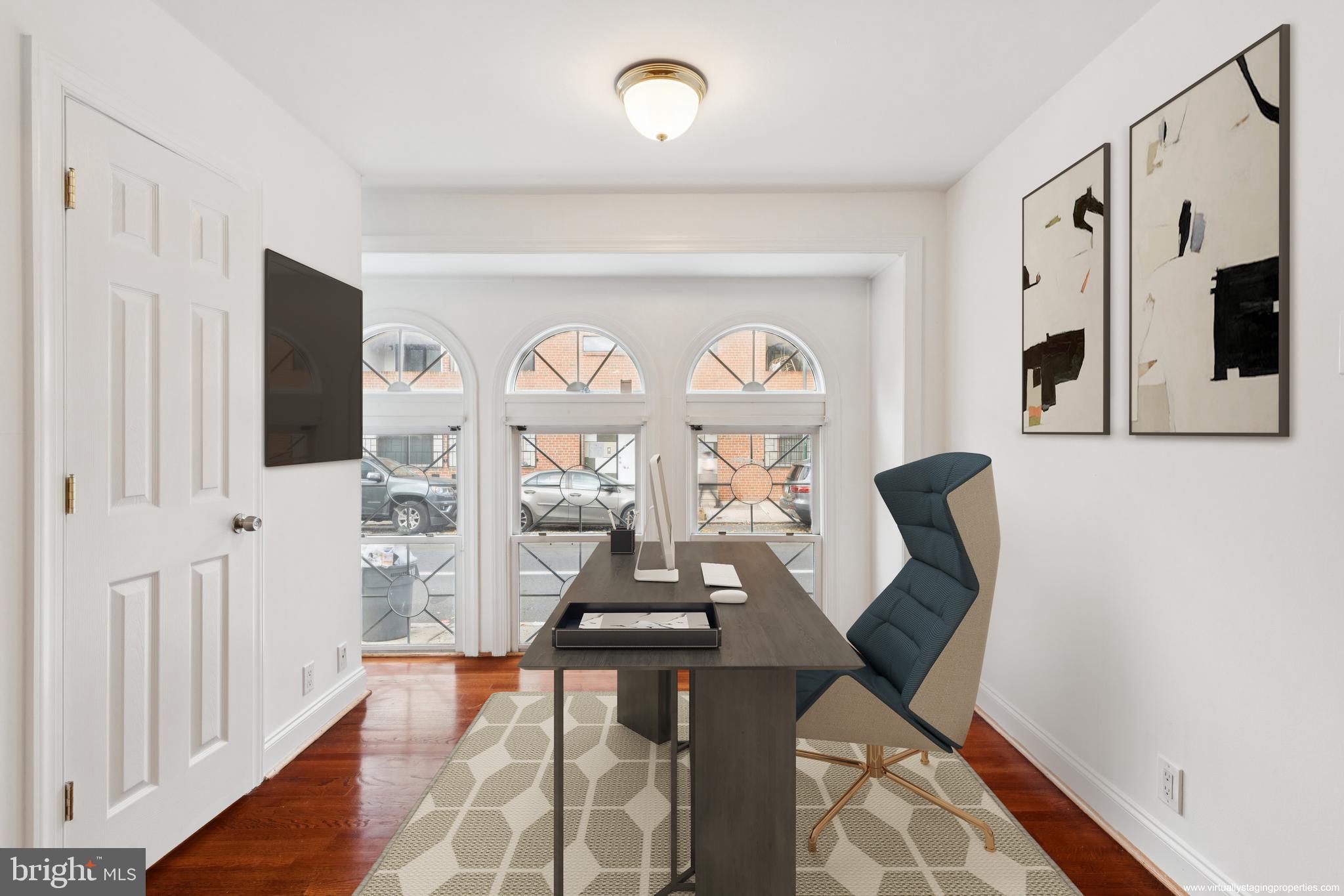1232 South Street, Unit A Philadelphia, PA 19147 - Photo 4 of 27 a view of a livingroom with furniture and window