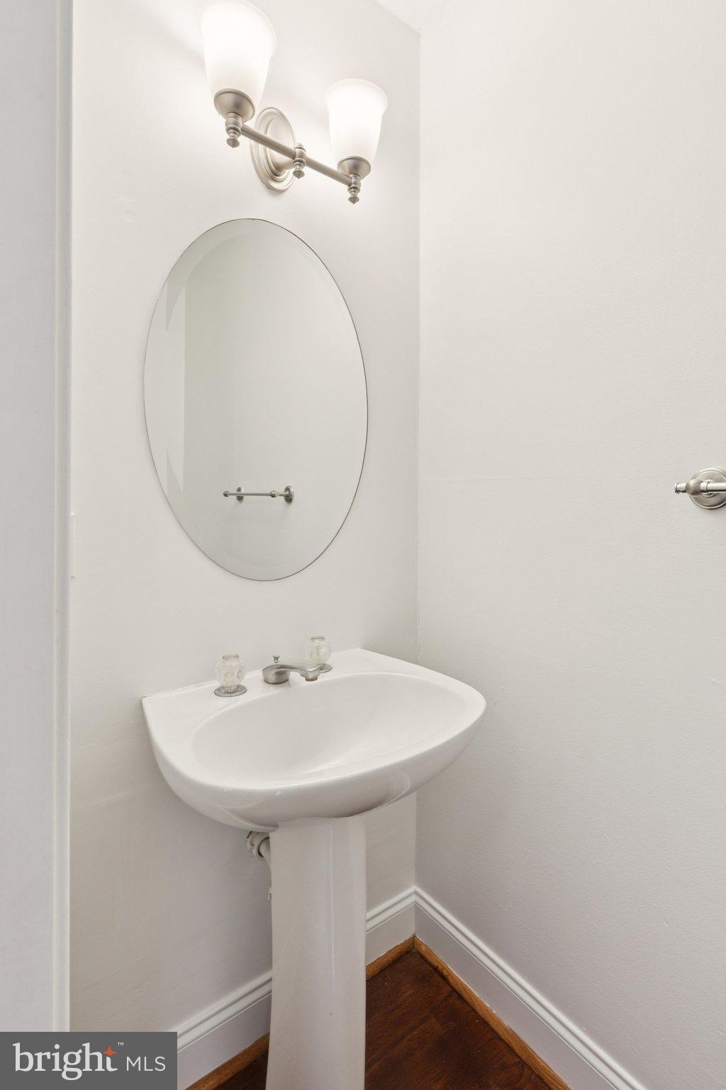 1232 South Street, Unit A Philadelphia, PA 19147 - Photo 5 of 27 a bathroom with a sink and a mirror