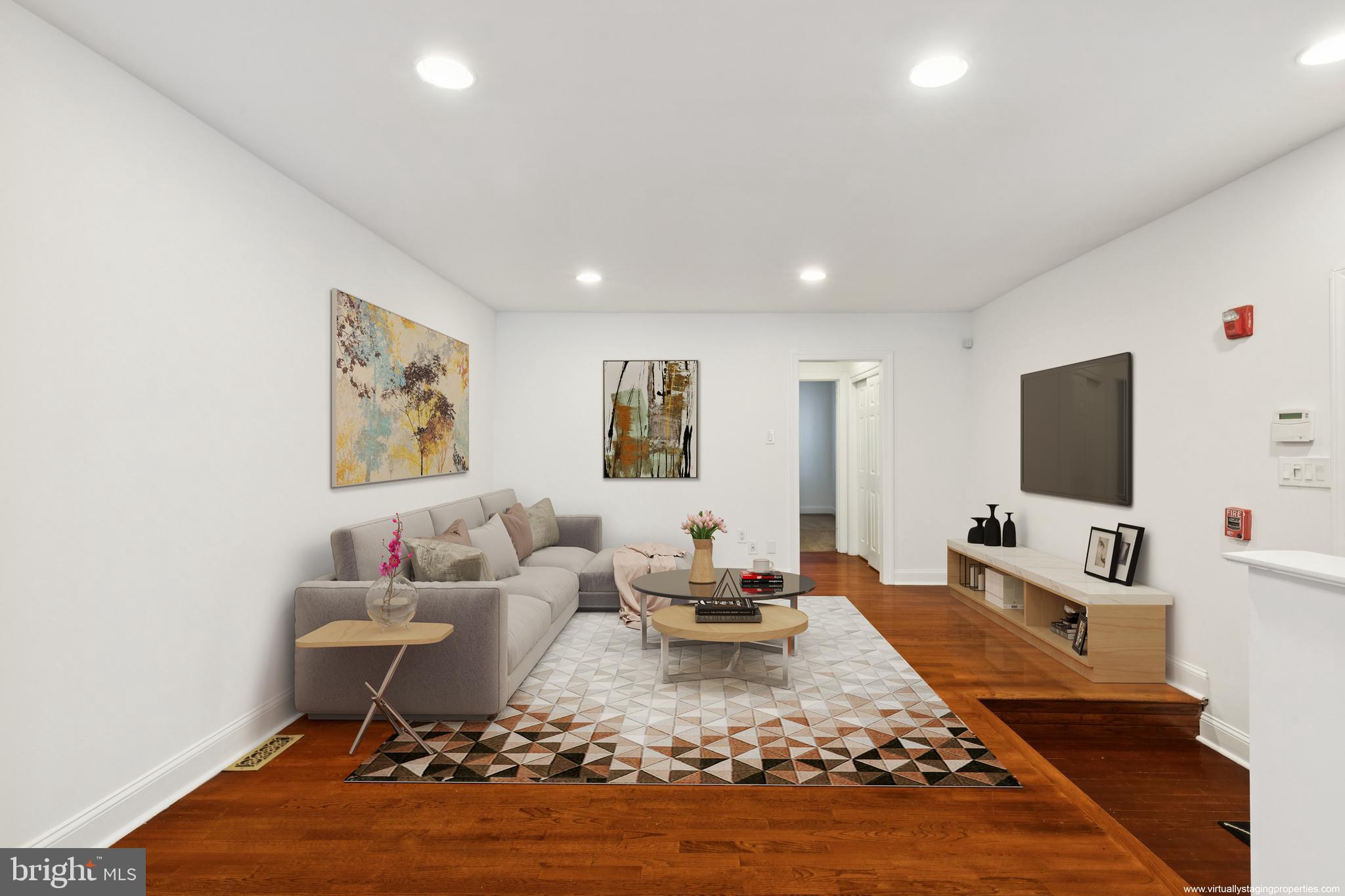 1232 South Street, Unit A Philadelphia, PA 19147 - Photo 7 of 27 a living room with furniture and a flat screen tv