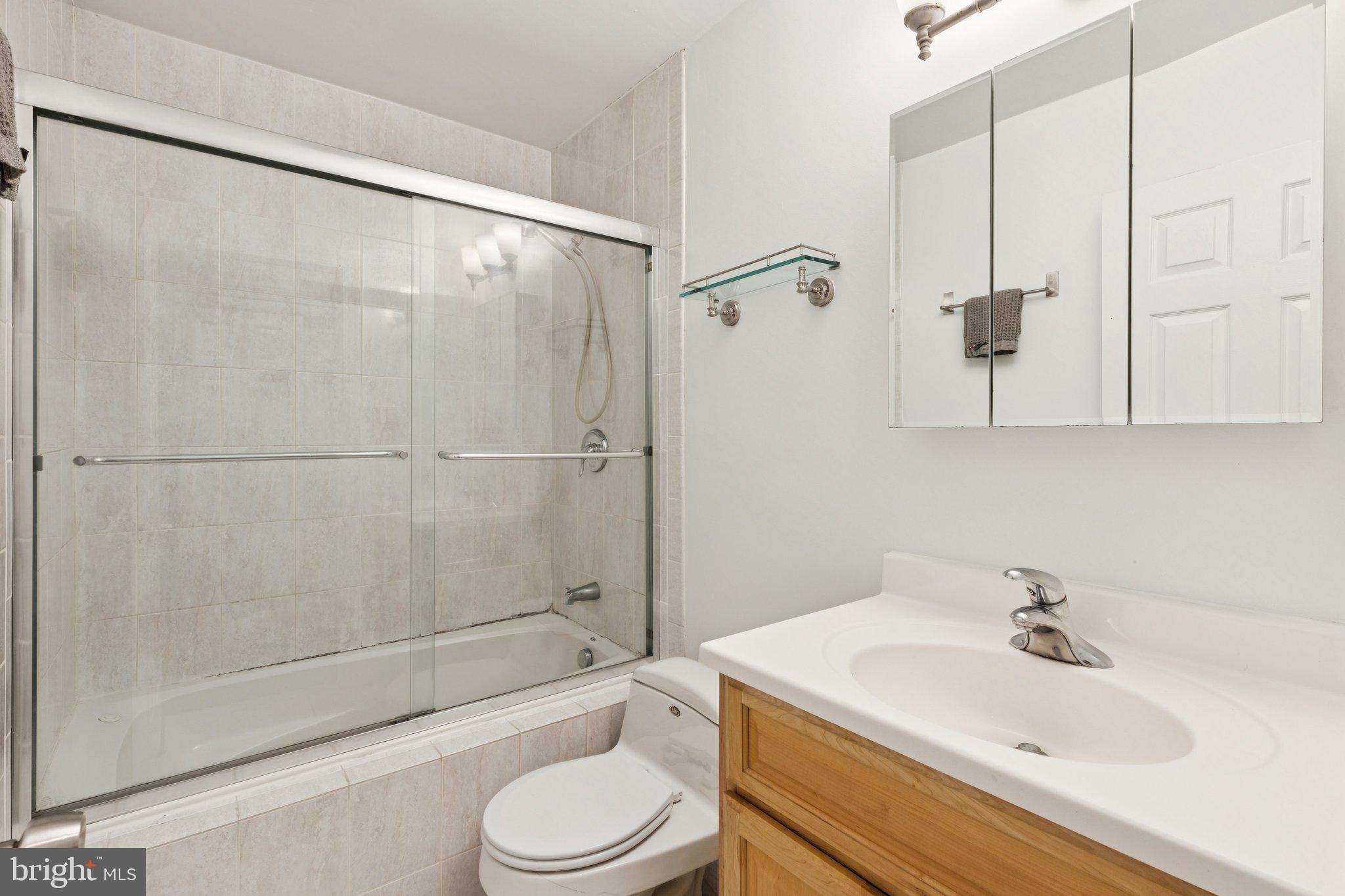 1232 South Street, Unit A Philadelphia, PA 19147 - Photo 10 of 27 a bathroom with a sink a toilet and shower