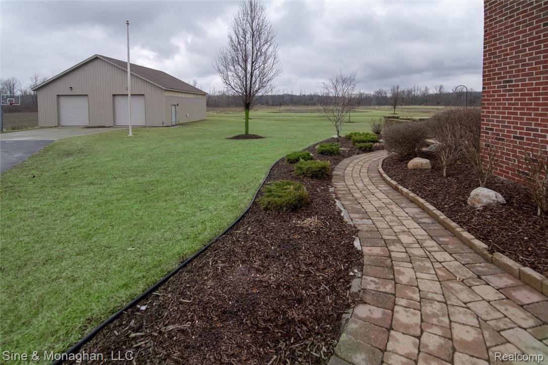 9722 Springborn Road Casco, MI 48064 - Photo 45 of 54 Paver walkway & Pole barn