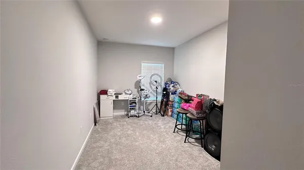 a view of room with gym equipment