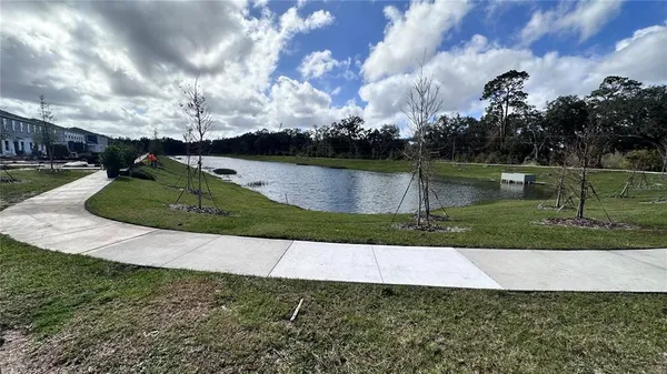 an aerial view of a houses with yard