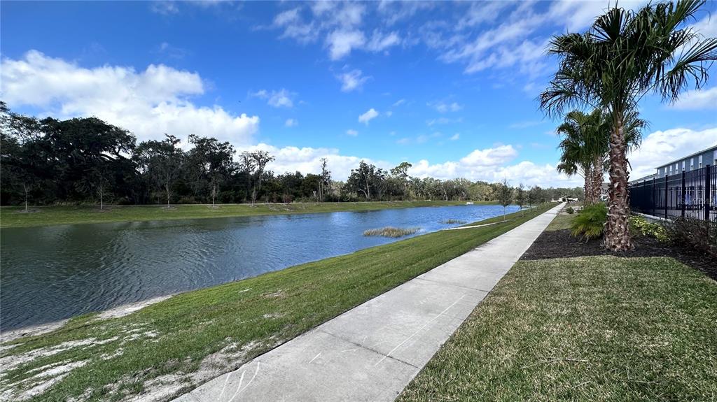 4424 Campsite Loop Orlando, FL 32824 - Photo 29 of 40 a view of a lake with a yard
