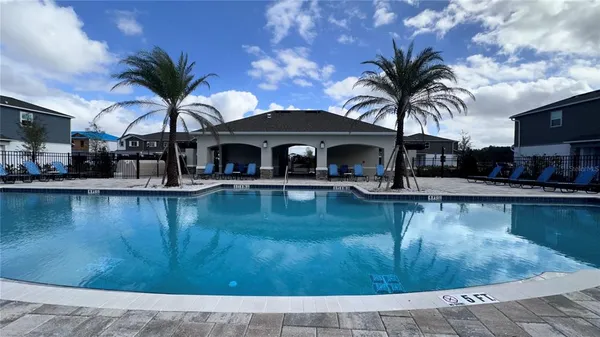 a swimming pool view with a garden view