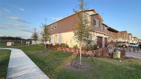 a front view of a house with a yard