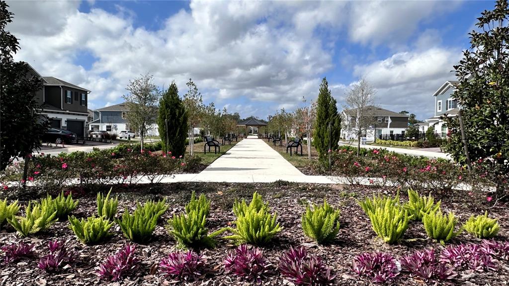 4424 Campsite Loop Orlando, FL 32824 - Photo 35 of 40 a view of a garden with flowers