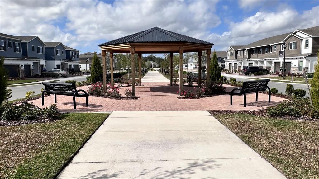 4424 Campsite Loop Orlando, FL 32824 - Photo 36 of 40 a view of a house with backyard porch and sitting area
