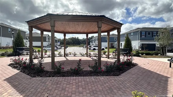 a view of a swimming pool with sitting area