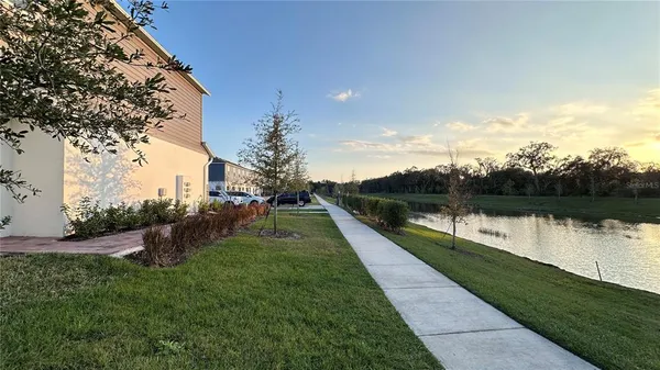 a view of a lake with a yard