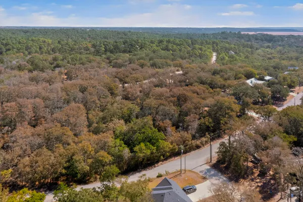 an aerial view of a houses with a yard