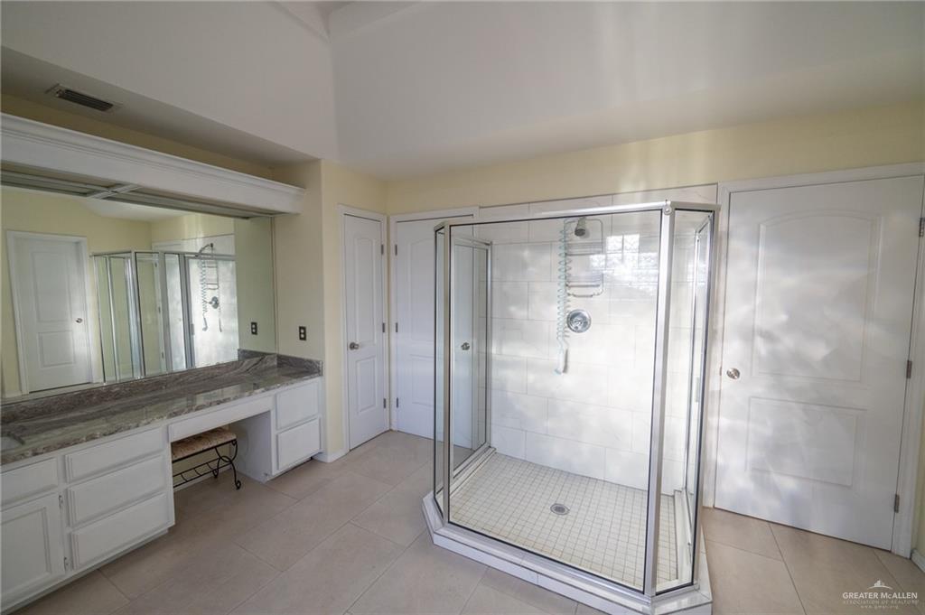 1901 Duke Avenue McAllen, TX 78504 - Photo 26 of 44 Bathroom with vanity, a shower with door, and tile patterned flooring