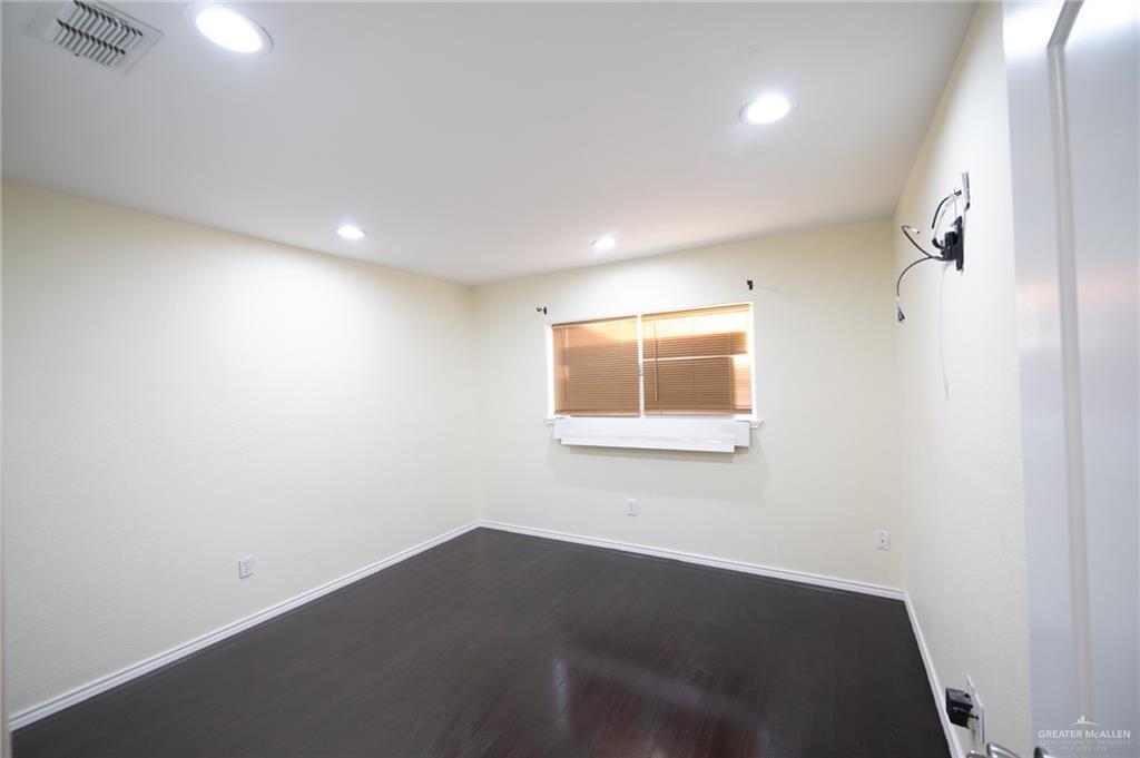 1901 Duke Avenue McAllen, TX 78504 - Photo 32 of 44 Empty room with hardwood / wood-style floors