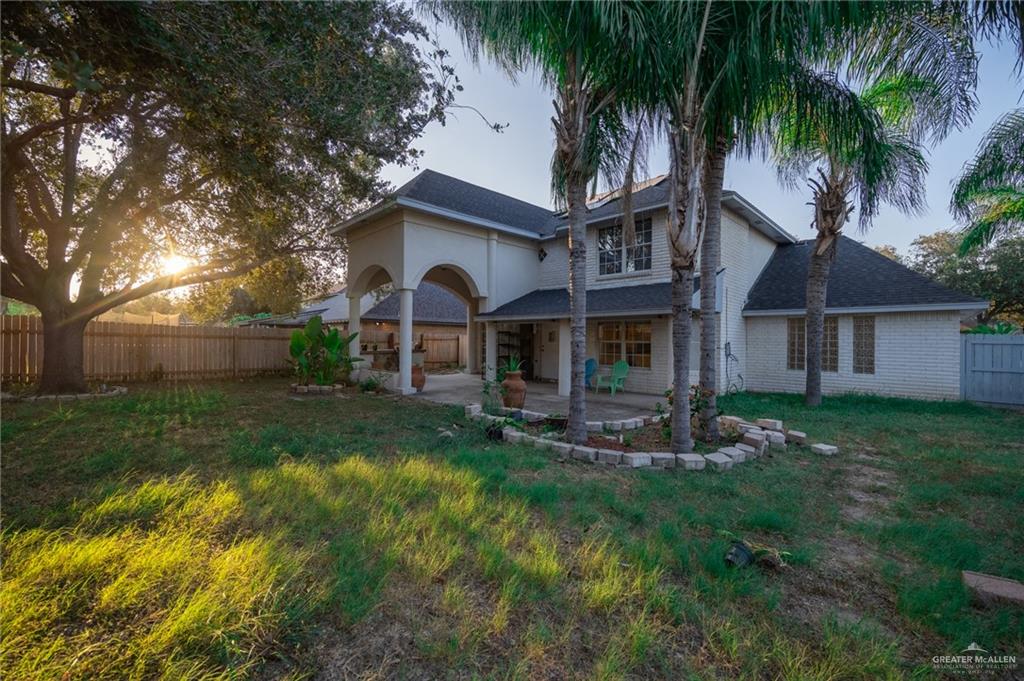 1901 Duke Avenue McAllen, TX 78504 - Photo 38 of 44 Back house at dusk featuring a lawn and a patio