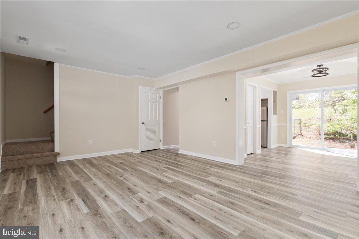 1811 Picadilly Circus Culpeper, VA 22701 - Photo 6 of 16 a view of an empty room with wooden floor and a window