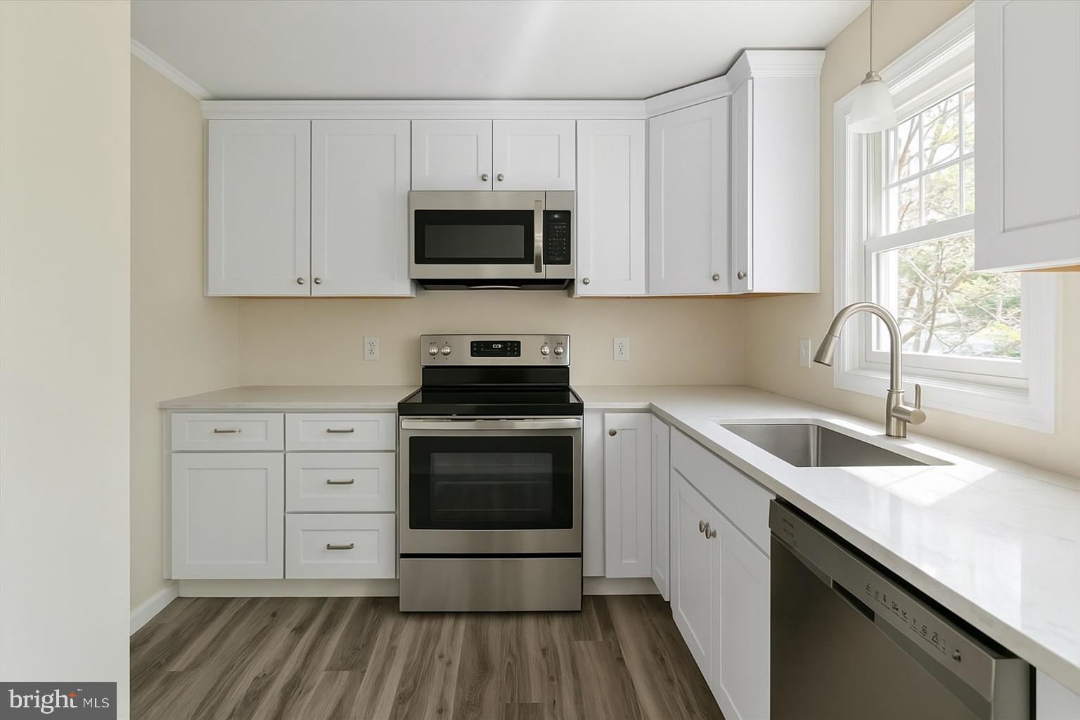 1811 Picadilly Circus Culpeper, VA 22701 - Photo 8 of 16 a kitchen with white cabinets sink and stainless steel appliances