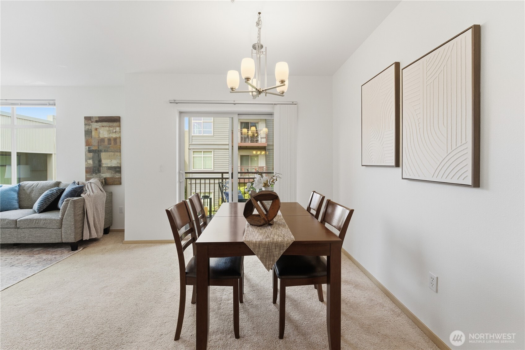3333 Wallingford Avenue North, Unit 203 Seattle, WA 98103 - Photo 12 of 37 a view of a dining room with furniture and chandelier