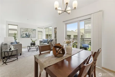 a view of a dining room with furniture window and outside view