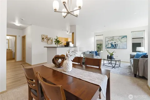 a view of a dining room with furniture and chandelier
